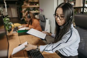 an AI assistant holding a notebook